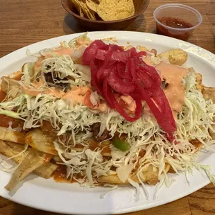 Pollo catracha. There's fried chicken under there somewhere