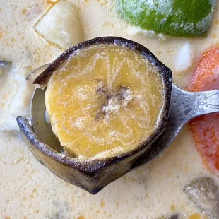 Unpeeled green plantains in the sopa. =T