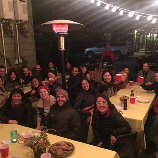 Abel in the back, happy customers in the front.