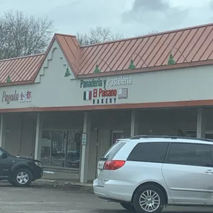 a car parked in front of a restaurant