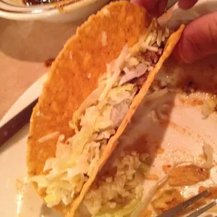 A taco with about a tablespoon of beef, a sprinkling of cheese and lettuce. Terrible.