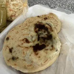 a close up of a pita and a pickle