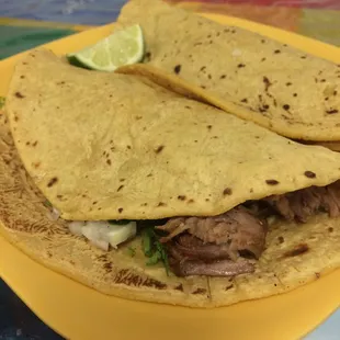 Two carnitas tacos with Huge handmade tortillas