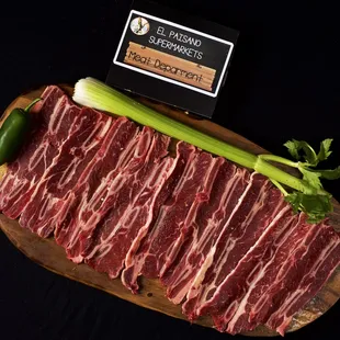 a piece of beef on a cutting board