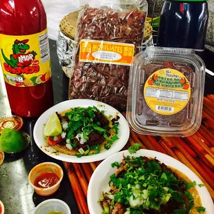 Adobada and carnitas tacos, chamoy sauce, chaca chaca, and tamarind paste.  Yum!