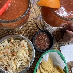 Micheladas, fresh chips and salsa, curtido