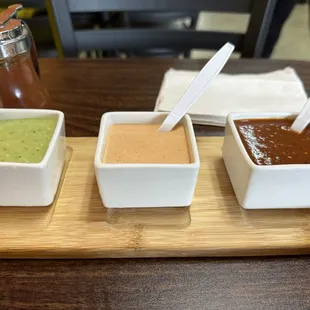 Selection of hot sauces that come with a burrito if you dine in.