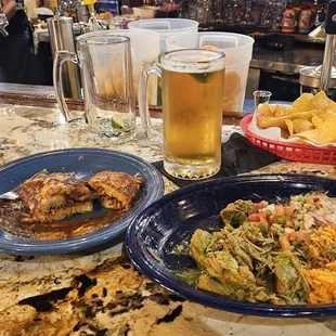 Carnitas with verde sauce and a tamal