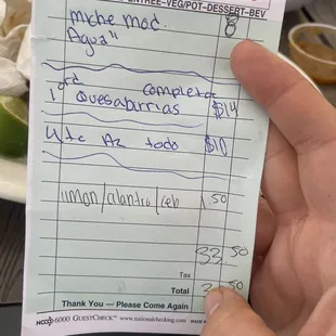 a hand holding a check
