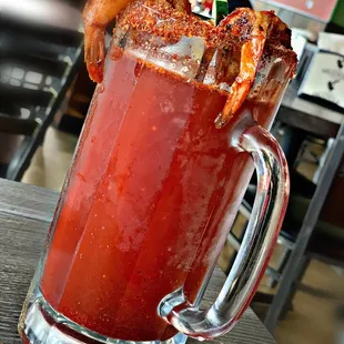 a bloody drink with shrimp