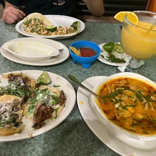 Lengua and chicken tacos, menudos soup, and mango/pineapple margarita