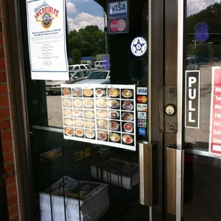 a sign on the door of a fast food restaurant