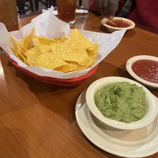 Chips salsa and guacamole with sweet tea