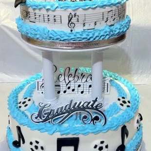 a tiered cake with musical notes