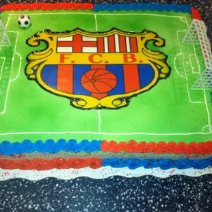 a cake with a picture of a soccer field