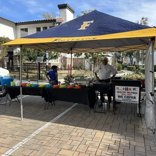 a table with food under a tent