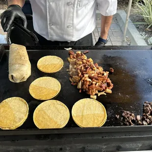 a man making tortillas