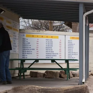 The menu and a picnic table for waiting.