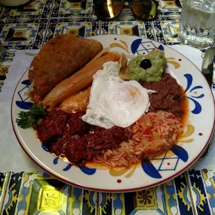 Mexican combination with egg on top