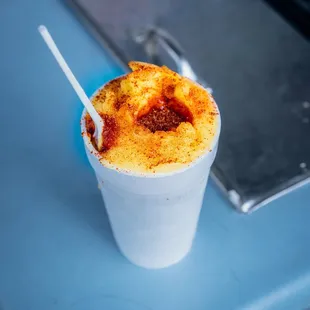a dessert in a plastic cup