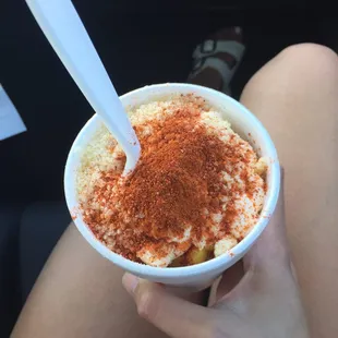 a person holding a bowl of food