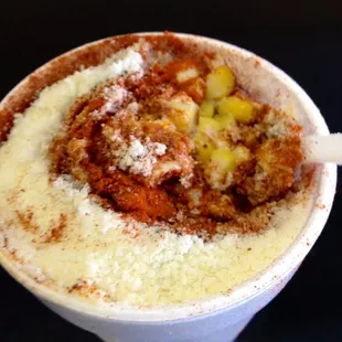 Corn with butter, mayo, Parmesan, hot chili powder and Lucas powder