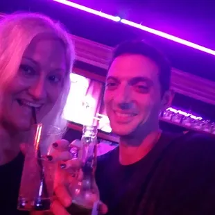 a man and a woman at a bar