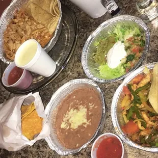 Chicken Fajitas, Pollo con Arroz, blueberry margarita, and patron margarita.