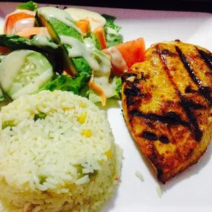 Pollo a la parrilla: Grilled marinated Chicken Breast; serverd with Rice &amp; salad..