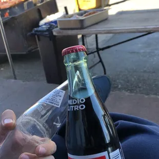 Enjoyed some ice cold soda in bottles while we waited for our sausage to be BBQ'd.