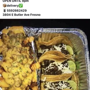 a tray of tacos and fries