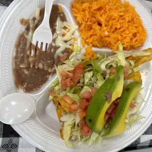 This is flautas with salad rice and beans