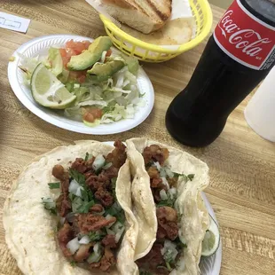 Tripa tacos, side salad, Mexican coke, buttered bread