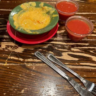 Melted fake cheese and an open can of blended tomatoes.  No flavor.  Had to ask for cilantro to add to the salsa.