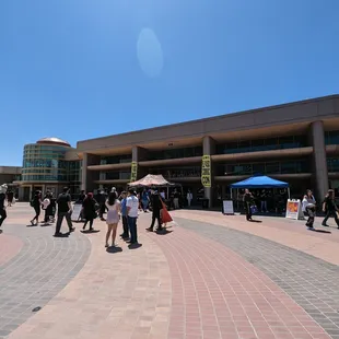 people walking around the plaza