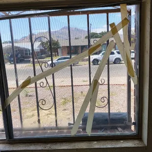 They broke a window....and tried to fix it with masking tape.