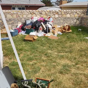 ONE of the piles of trash they left behind, much of it blowing all over the back yard...