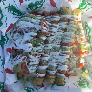 Flautas with lettuce and tomato