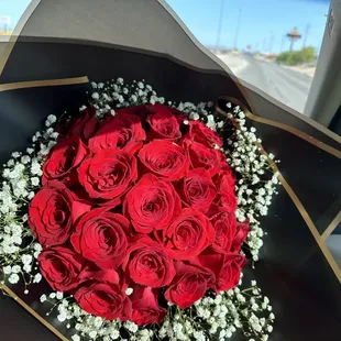 Wrapped bouquet, 25 red roses w/ babys breath