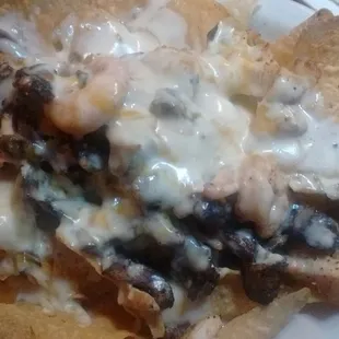 Nachos with Steak, Chicken, and Shrimp (beans and cold toppings on the side)