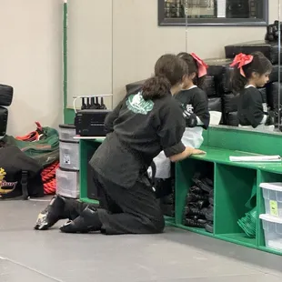 Ms Savanna helping my little dragon with her gear and giving her words of encouragement.