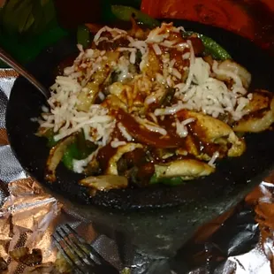 An inviting atmosphere and decorative dining room, I was pleased with the extensive menu- pictured above: Mocajete