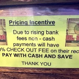 Sign about 3.5% fee for non-cash payments