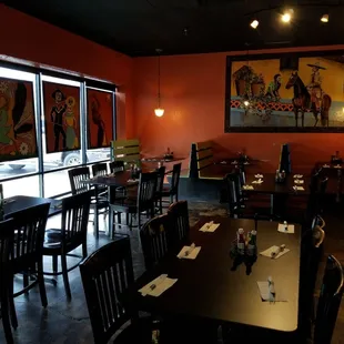 a dining room with tables and chairs