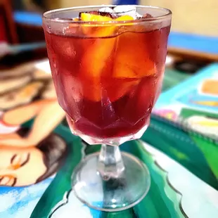 A glass of sangria. Fruity and sweet with a  modest red wine flavor.