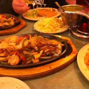 Chicken Fajitas and the chips and 3 salsas