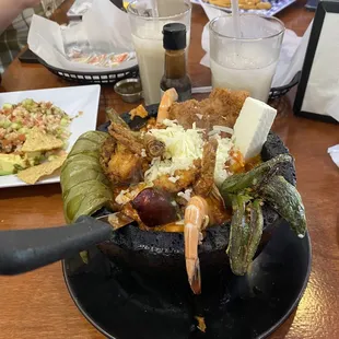 Seafood molcajete with shrimp, fish, octopus and imitation crab