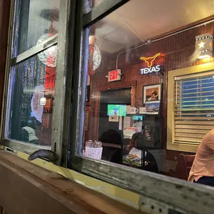 a view of a restaurant through a window