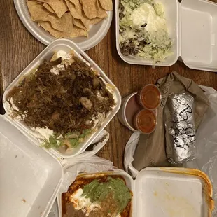 rice bean cheese (RBC) burrito, wet carnitas CA burrito, carnitas nachos, chips (salsa in the middle), &amp; carne asada sopes