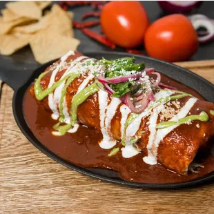 Carne asada burrito with red sauce.